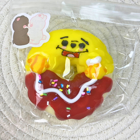 Smiling Donut Squishy Toy with Frosting and Sprinkles